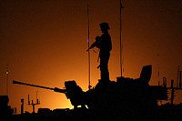 Silhouette of Warrior in a burning oil field in southern Iraq