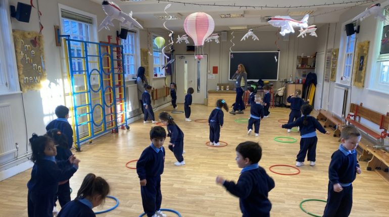 Students playing with hula hoops