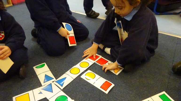 Children looking at different shapes