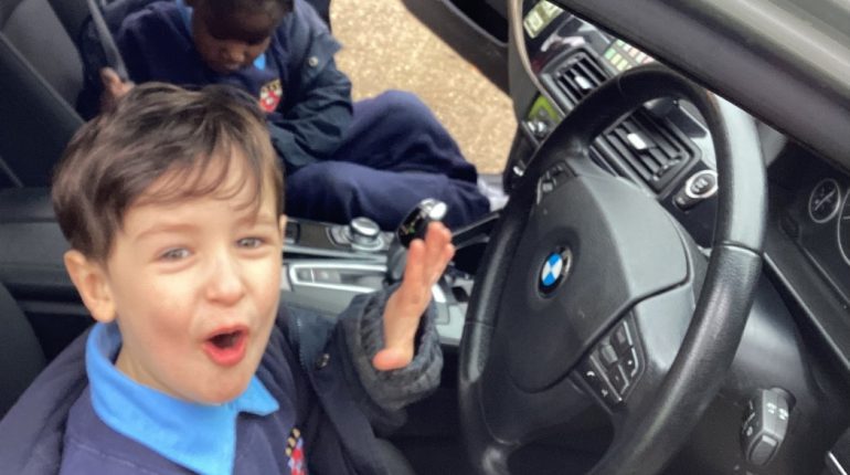 Child sat in the front seat of a police car