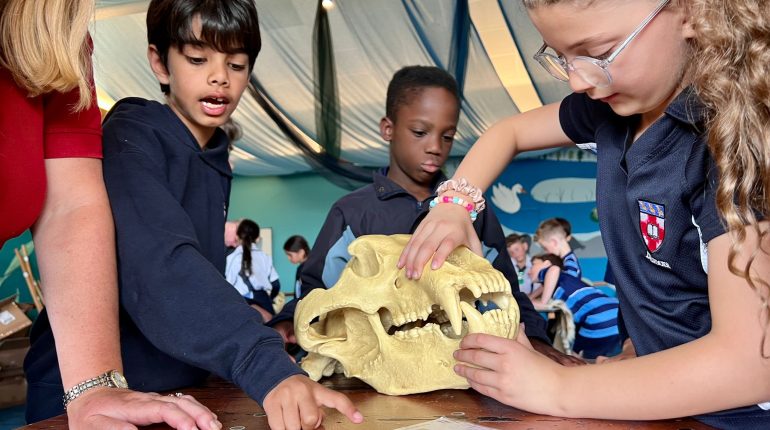 students holding a skull