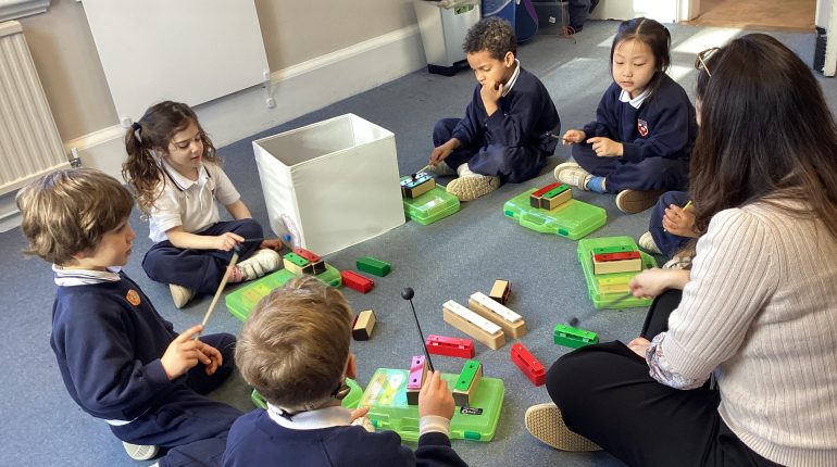 children using xylophones