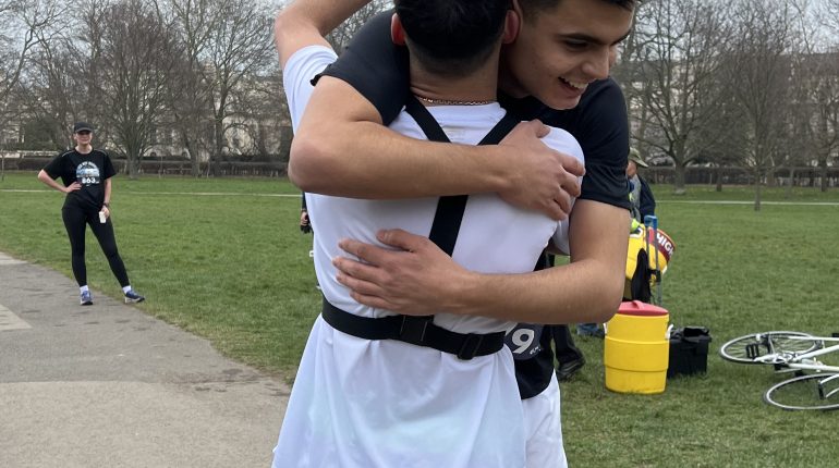2 students hugging