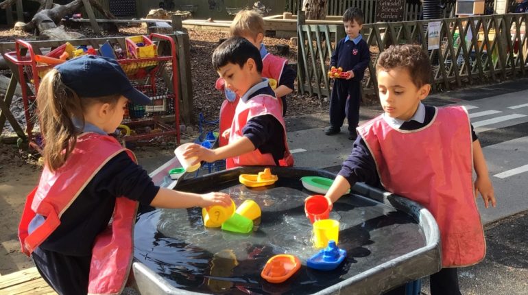 children getting involved in water play