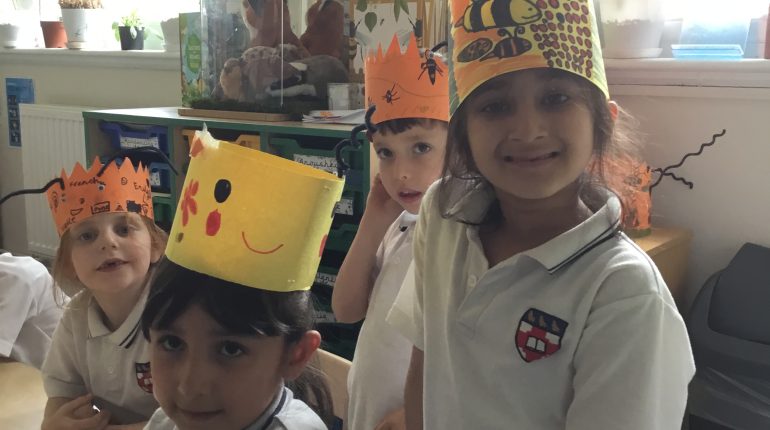 children wearing paper hats