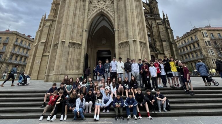 students in front of a building