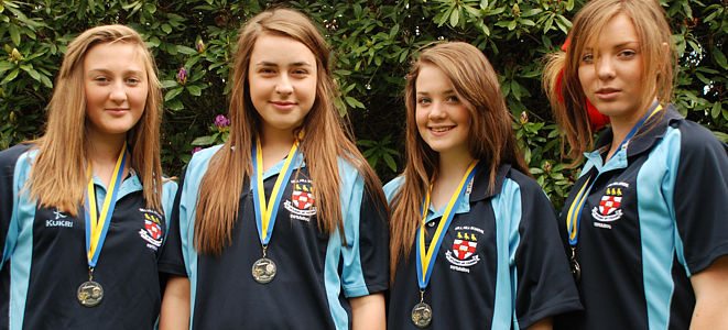 Girl swimmers with their medals